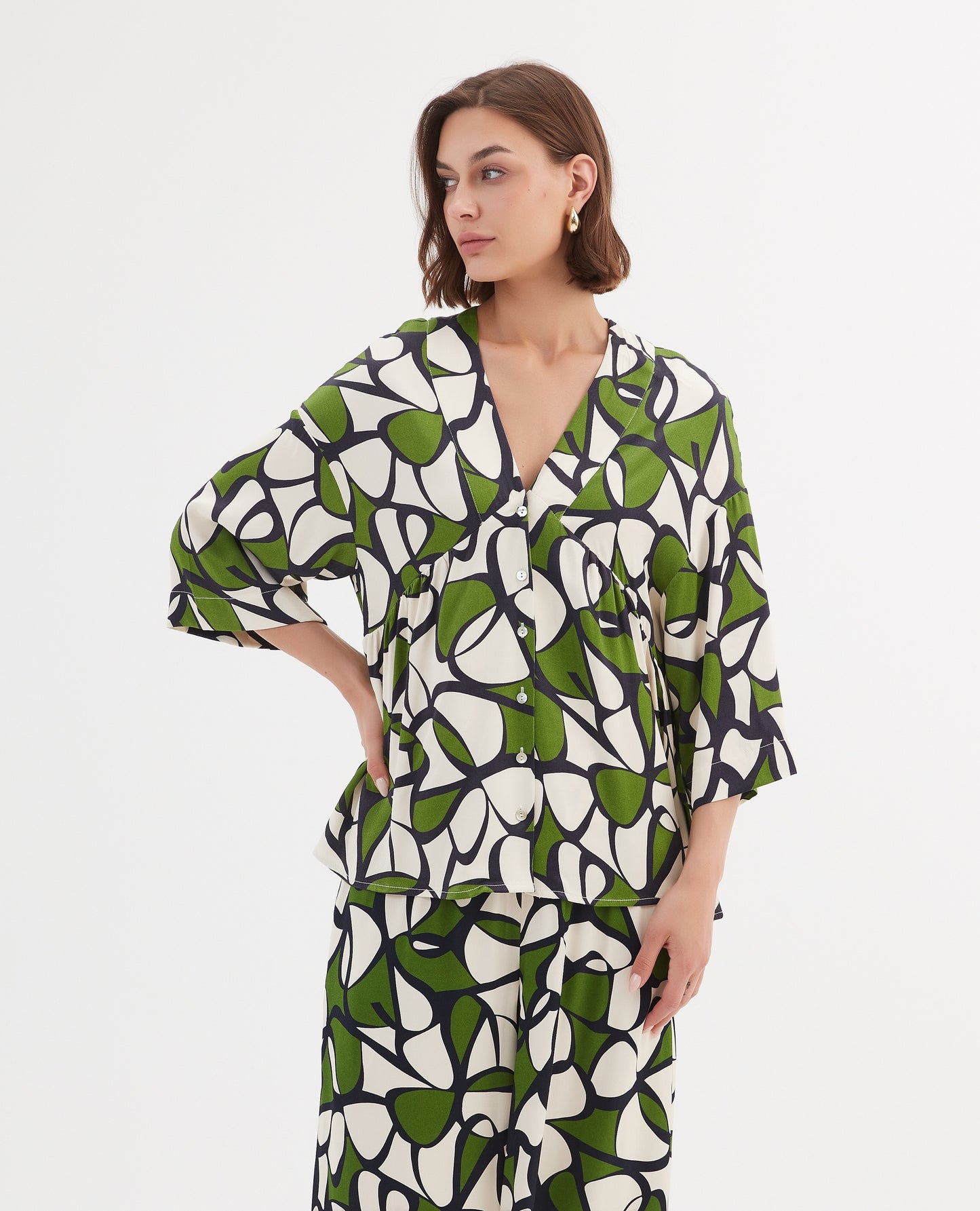 Tirelli V Neck Peplum Top - Green Oasis Print